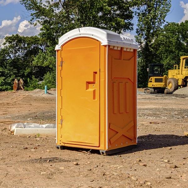 how often are the portable restrooms cleaned and serviced during a rental period in Helmville